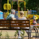 Grandparents watching their grandchildren play photo for tax-inclusive gifts tax strategy calculator.