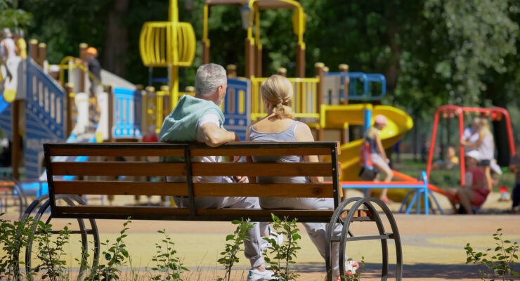 Grandparents watching their grandchildren play photo for tax-inclusive gifts tax strategy calculator.