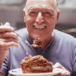Extra year Section 199A deduction blog post showing man enjoying piece of cake