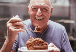 Extra year Section 199A deduction blog post showing man enjoying piece of cake