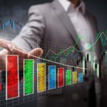 Picture of Businessman pointing to a growth chart showing business success