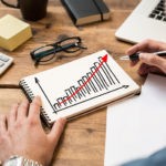 Picture showing entrepreneur calculating small business returns on investment