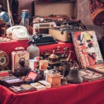 A picture of antique watches, magazines, phones, suitcases and other retro products for a blog post about Section 199A trade or business