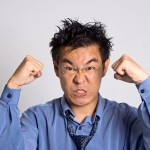 Picture of angry accountant clinching fists and scowling.