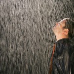 Picture of man standing in pouring rain
