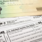 Picture of a tax refund check on top of 1040 tax return.