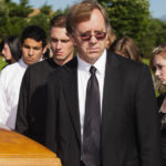 People at a graveside service