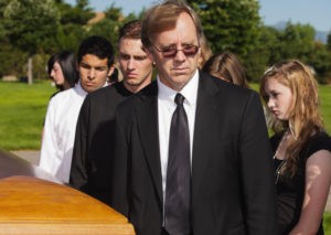 People at a graveside service