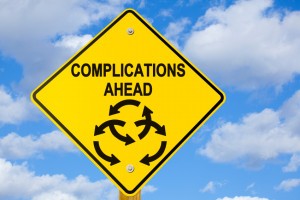 Picture of road sign with message complications ahead