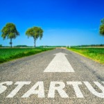 Conceptual Startup word painted on asphalt road