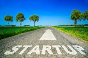 Conceptual Startup word painted on asphalt road