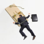 Picture of Businessman trapped on mousetrap