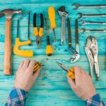 Picture of hand tools on a blue wooden table