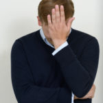 Picture of Studio portrait of young businessman who did big mistake vertical shot
